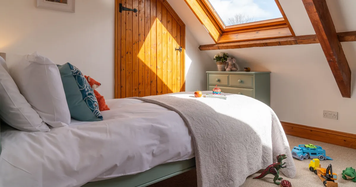 Mangers bedroom with childrens toy on the bed