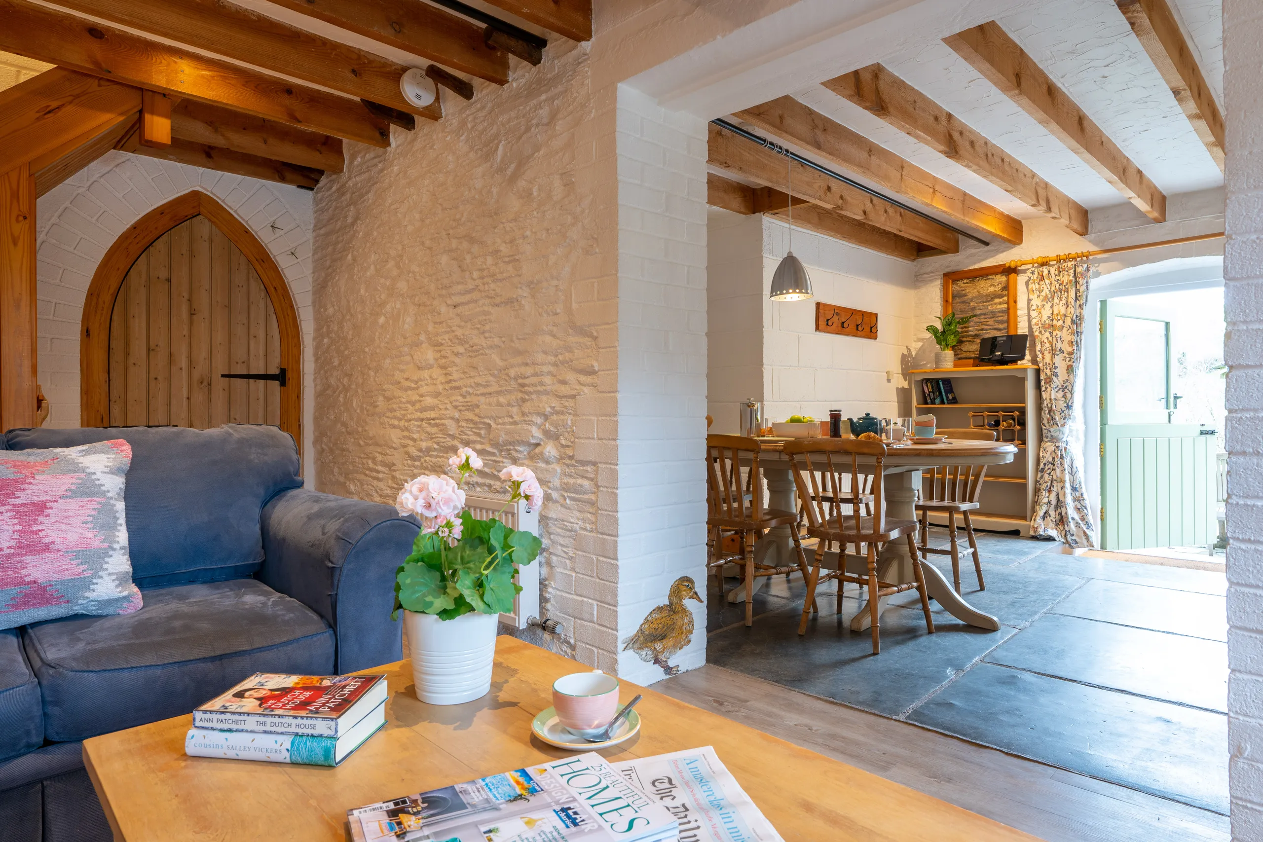 Ducks Nest living area with two sofas and open plan into the kitchen