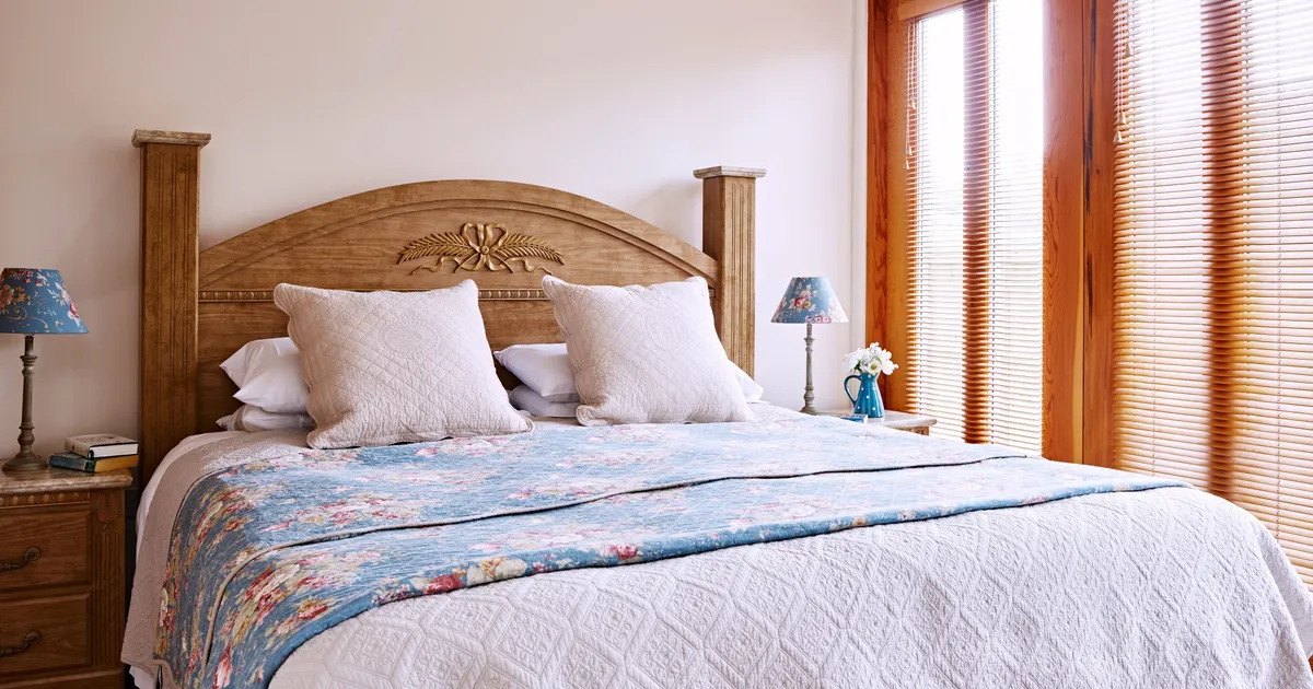 Ordhard bedroom with beautiful ornate carved headboard