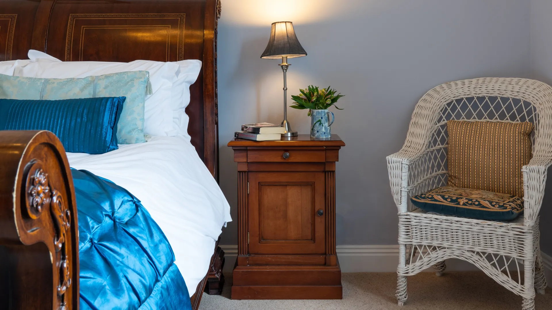 Traditional double bed with blue cover