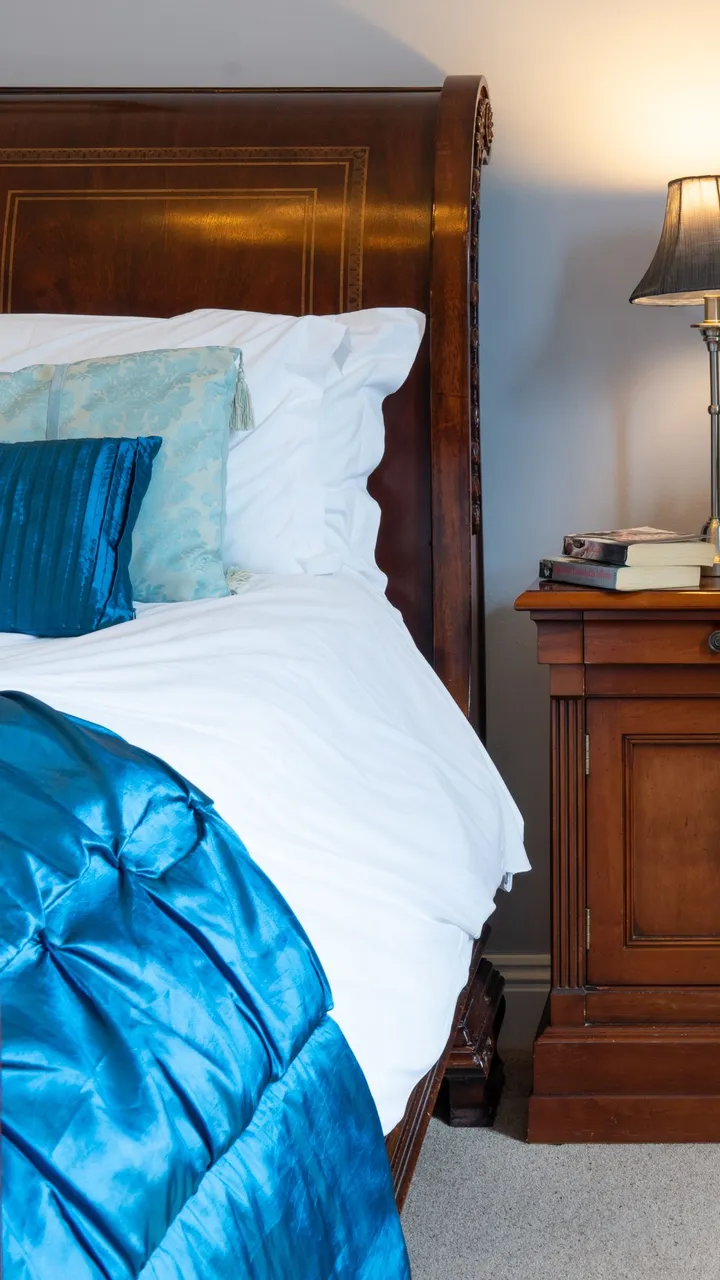 Traditional double bed with blue cover