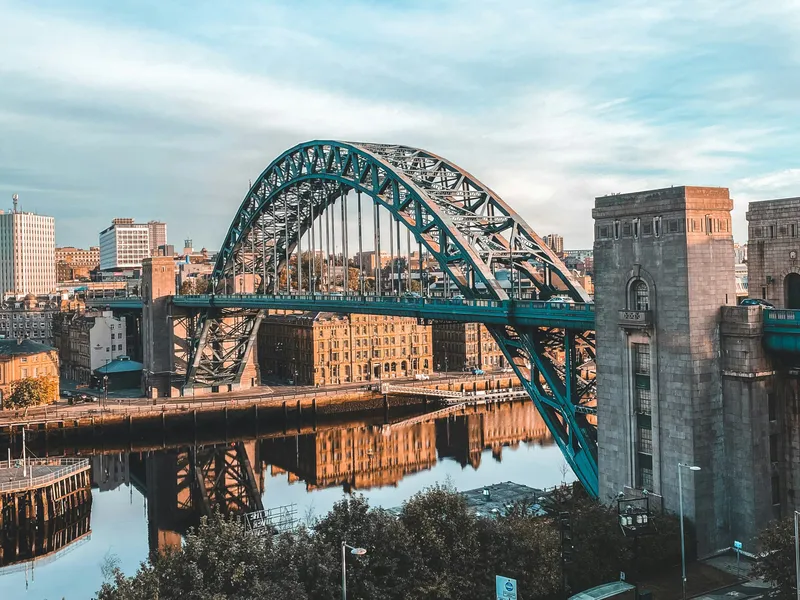 Tyne Bridge spanning the River Tyne in Newcastle upon Tyne under a blue cloudy sky