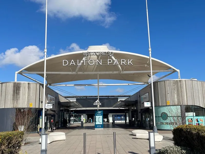 Entrance to Dalton Park beneath a white canopy on a sunny day