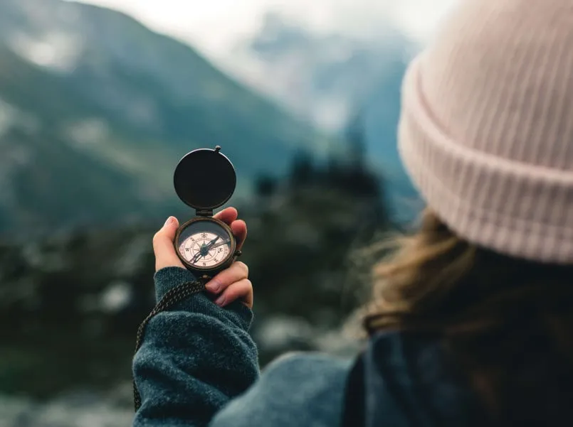 Woman holding compass