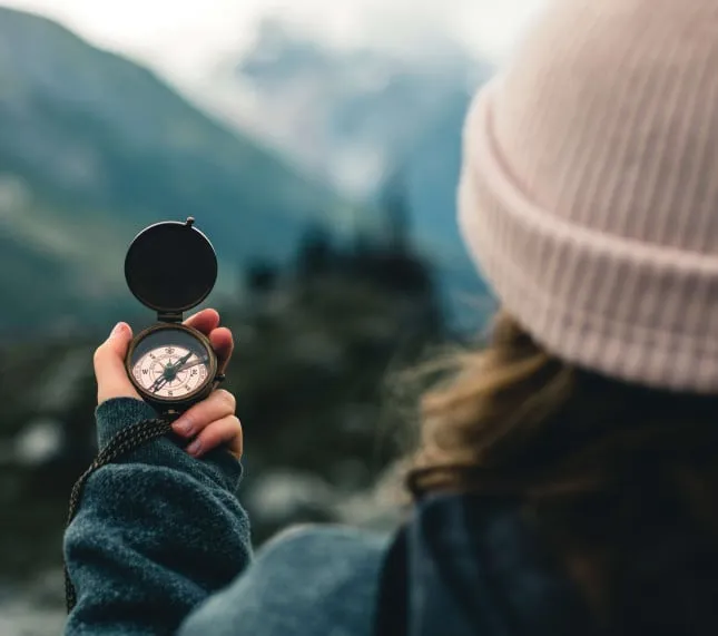 Lady holding compass out