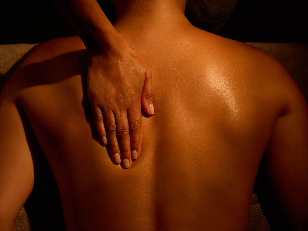 Person receiving a relaxing back massage