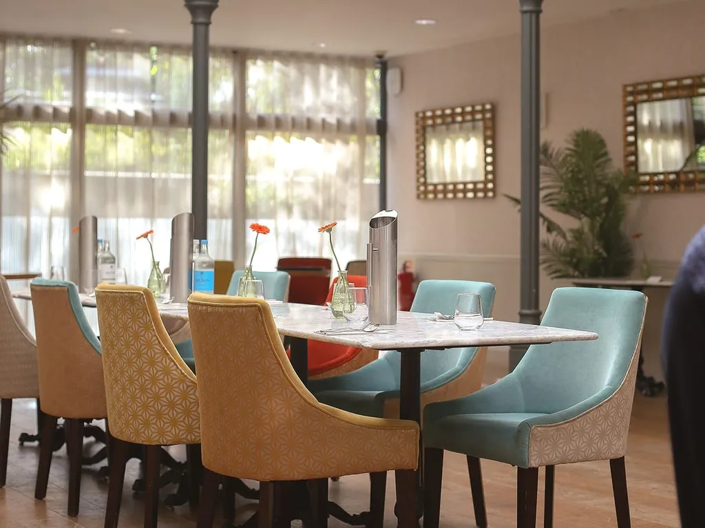 Dining table set up in centre of room