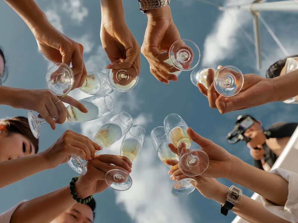 People raising glasses of champagne