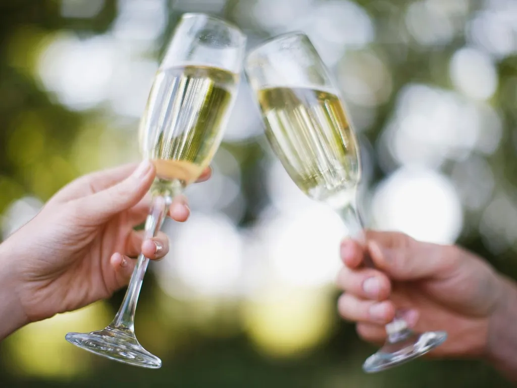 Raising champagne glasses