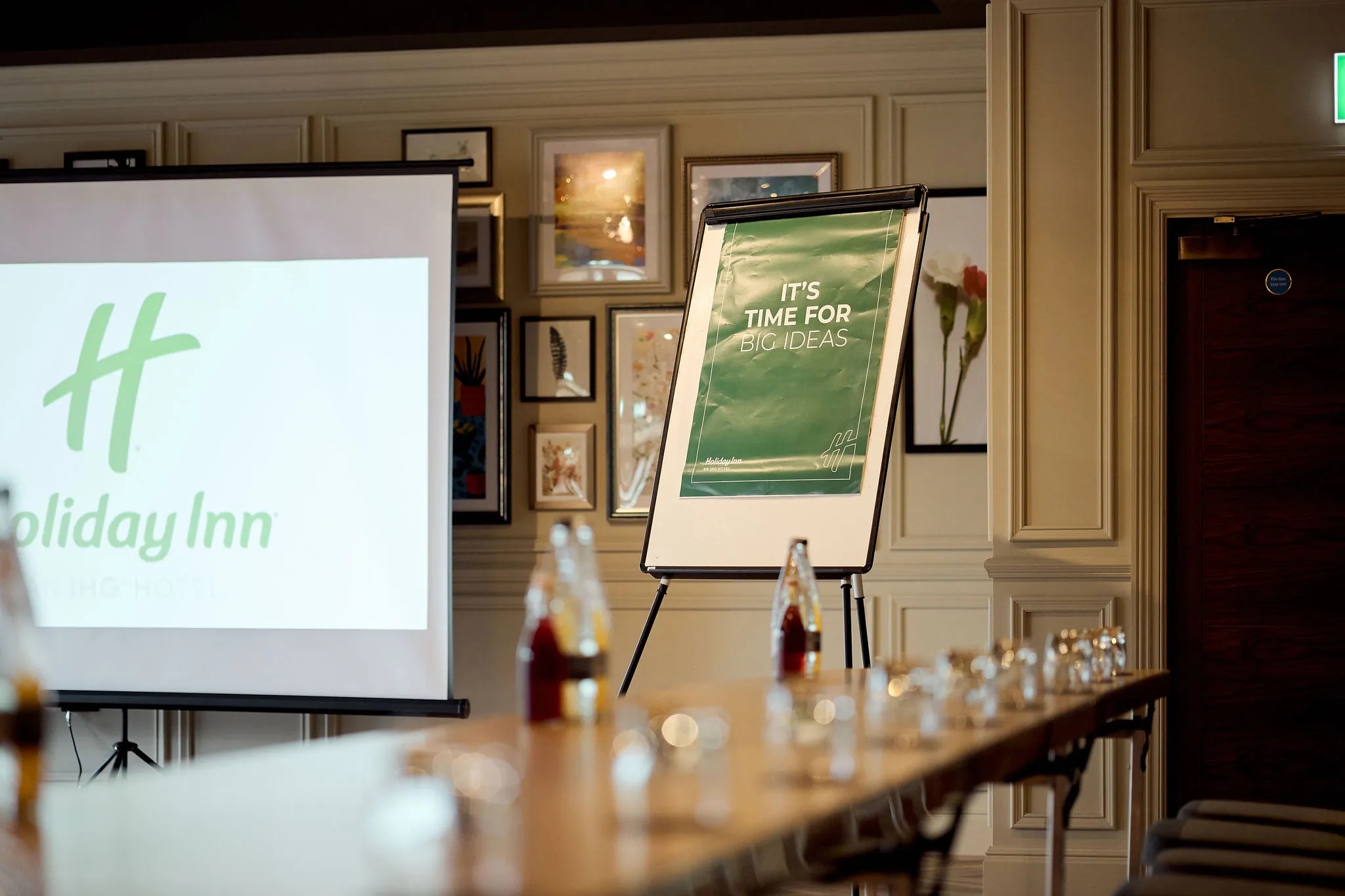Meeting room with projector screen and flip chart at Holiday Inn