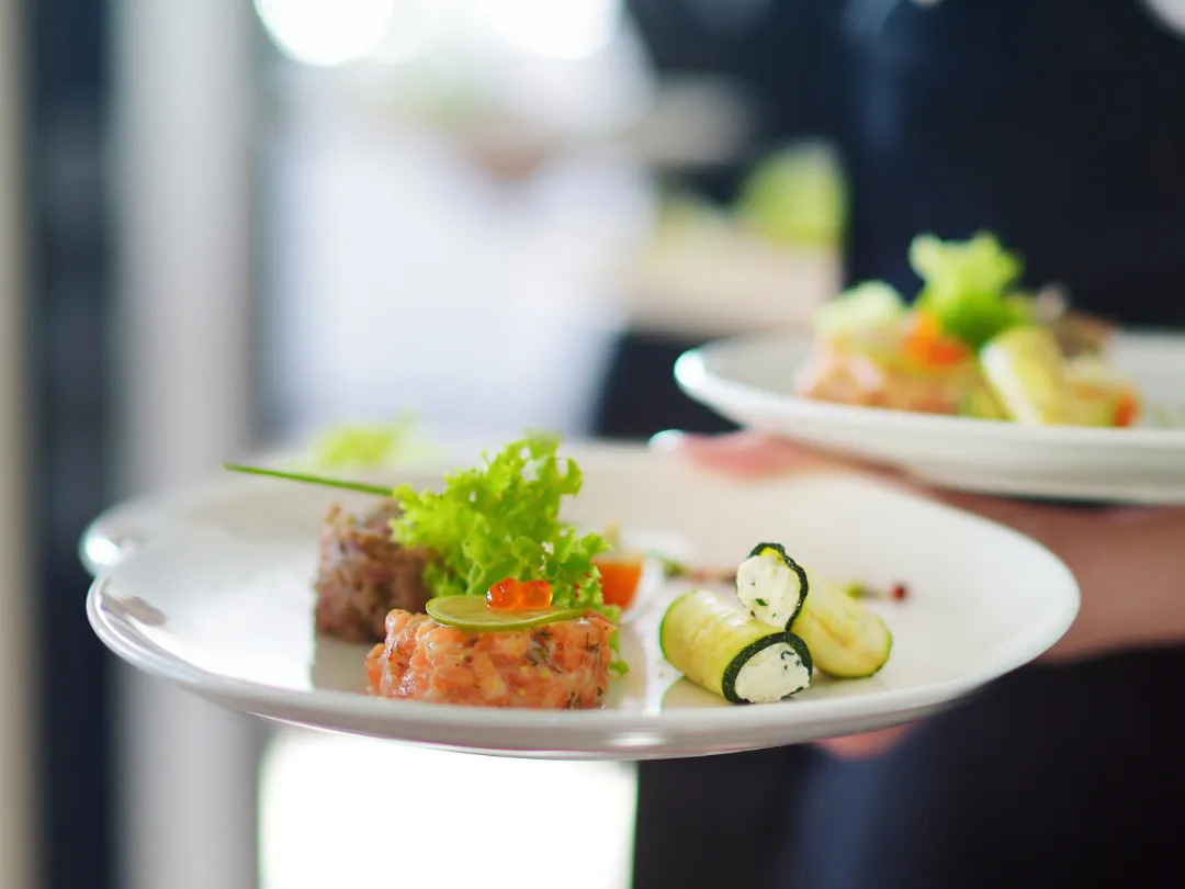 Elegant wedding starter being served on white plates at Hadrian Park