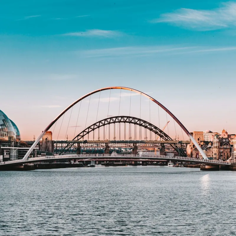 View of the River Tyne with the Gateshead Millennium Bridge, Tyne Bridge and Sage Gateshead at sunset
