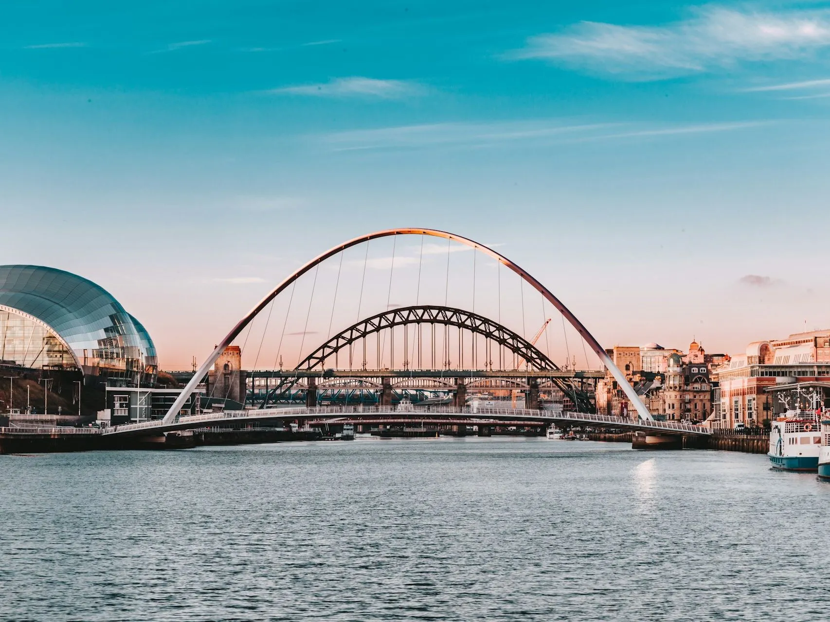 View of the River Tyne with the Gateshead Millennium Bridge, Tyne Bridge and Sage Gateshead at sunset