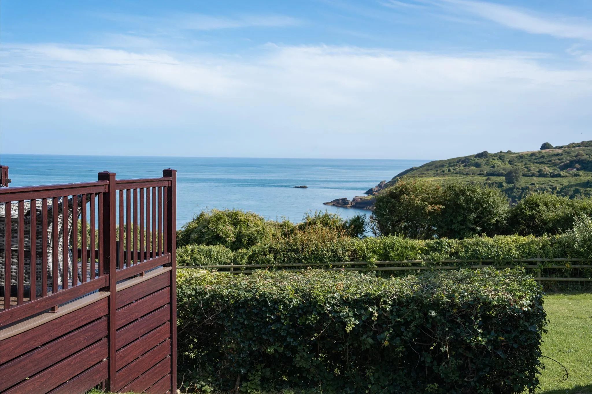 Cliff top sea views from a park-side lodge decking at Riviera Bay, Devon