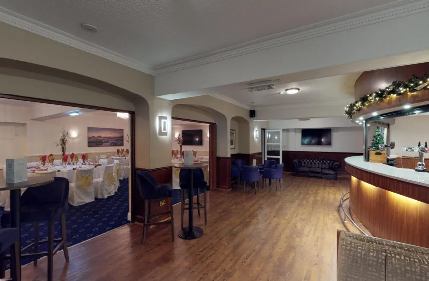 Hotel bar and adjoining function room set up for a formal event