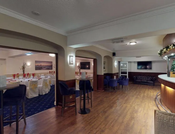 Hotel bar and adjoining function room set up for a formal event
