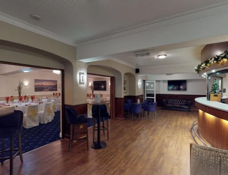Hotel bar and adjoining function room set up for a formal event