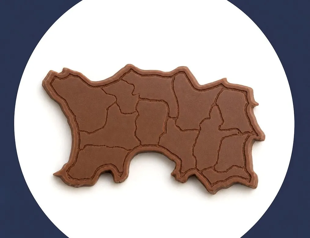 Milk chocolate shaped like the island of Jersey with parish outlines embossed on the surface