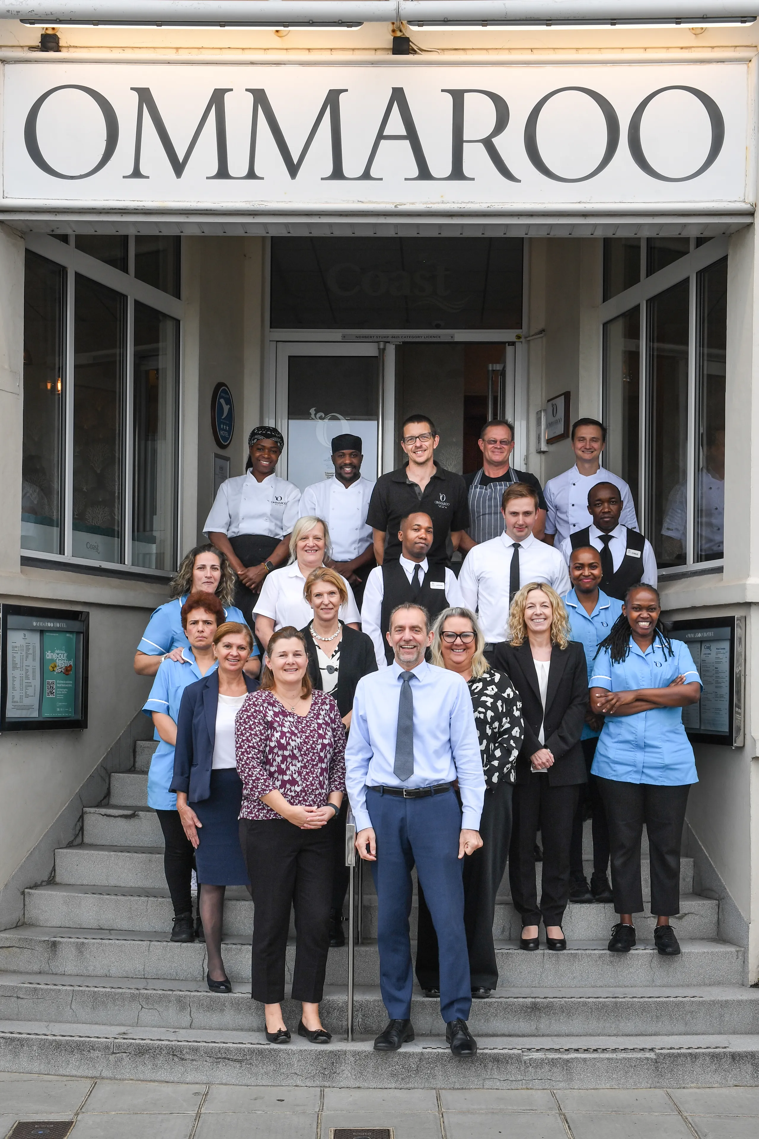 Group photo of the JEP team standing on the steps outside Ommaroo Hotel in November 2025.