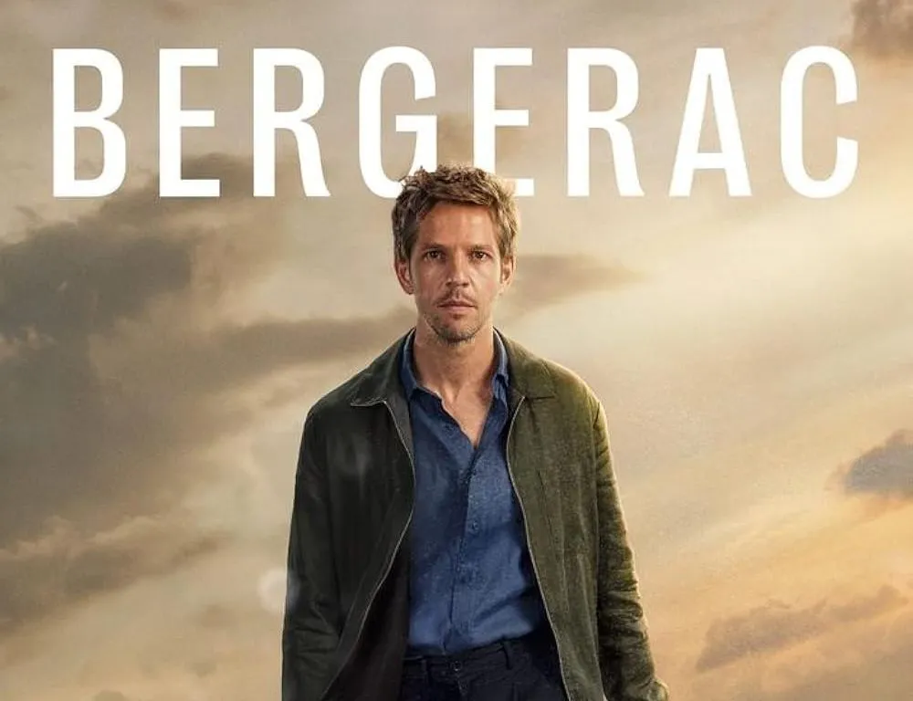 Promotional poster for Bergerac showing a man walking along a dramatic rocky coastline beneath cloudy skies.