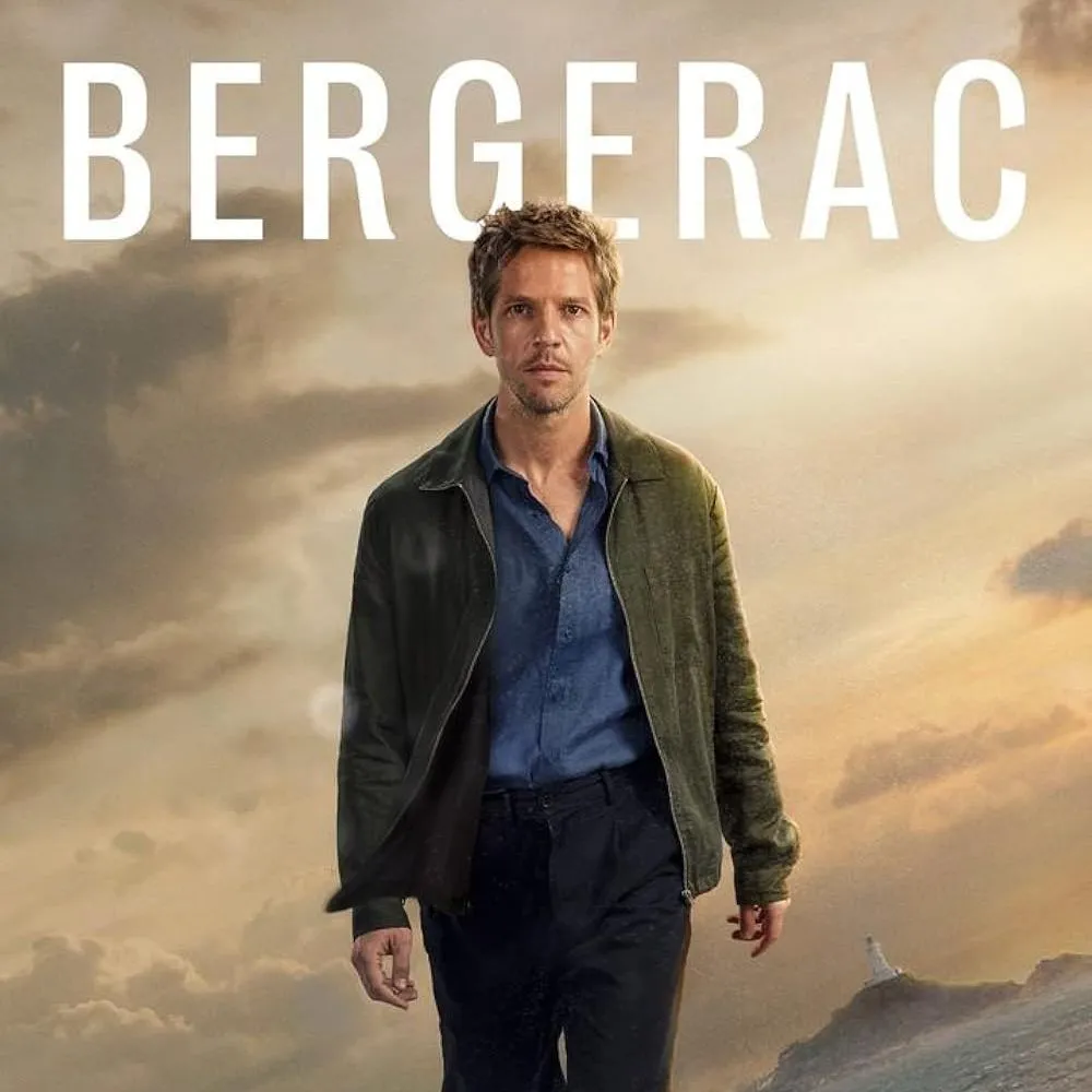 Promotional poster for Bergerac showing a man walking along a dramatic rocky coastline beneath cloudy skies.