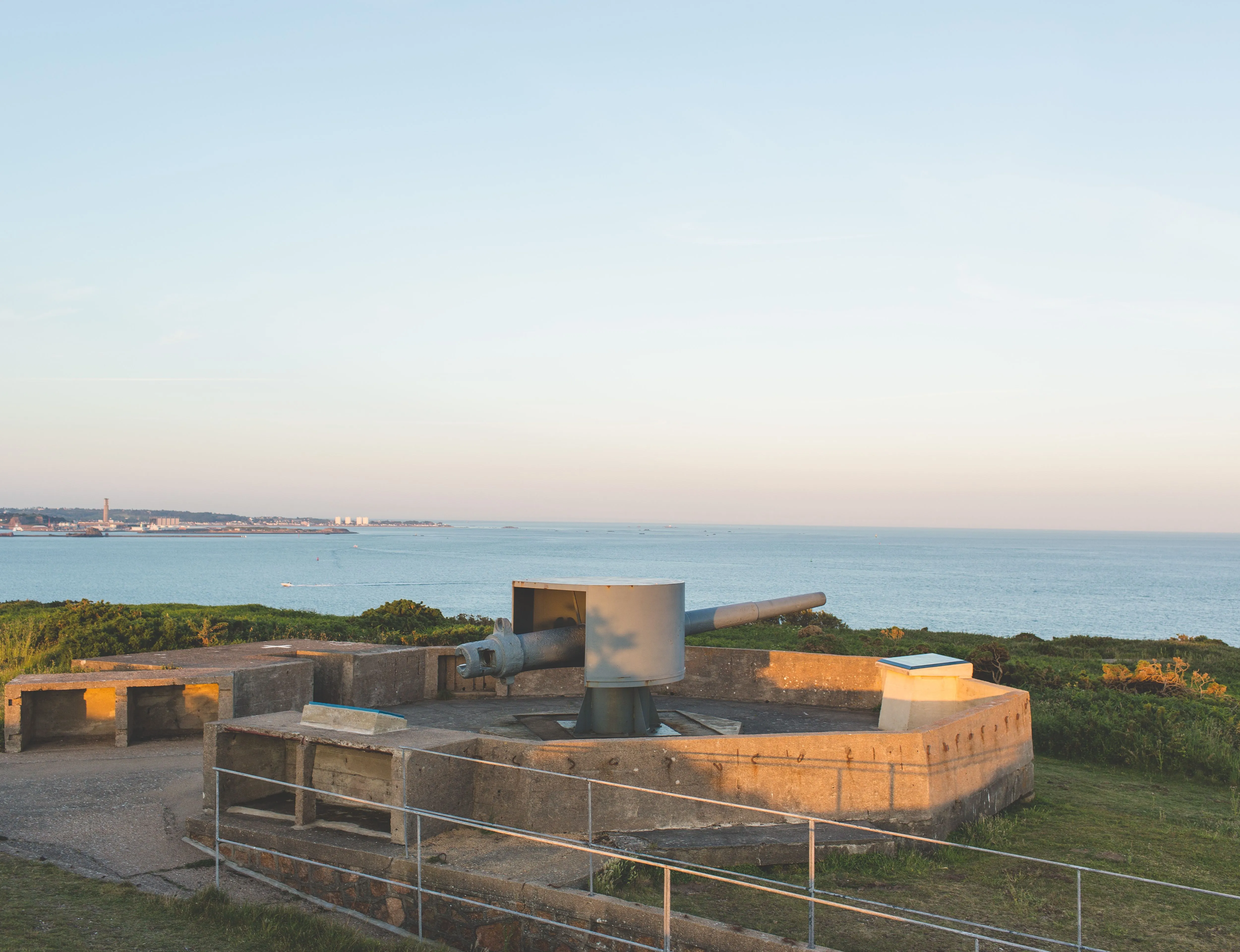Coastal artillery gun emplacement overlooking the sea at Noirmont in warm evening light