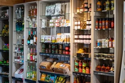 Shelves of local produce, drinks and gifts in a farm shop