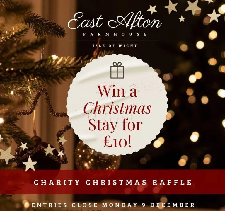East Afton Farmhouse Christmas charity raffle post offering a chance to win a Christmas stay for £10, with festive lights and a decorated Christmas tree.