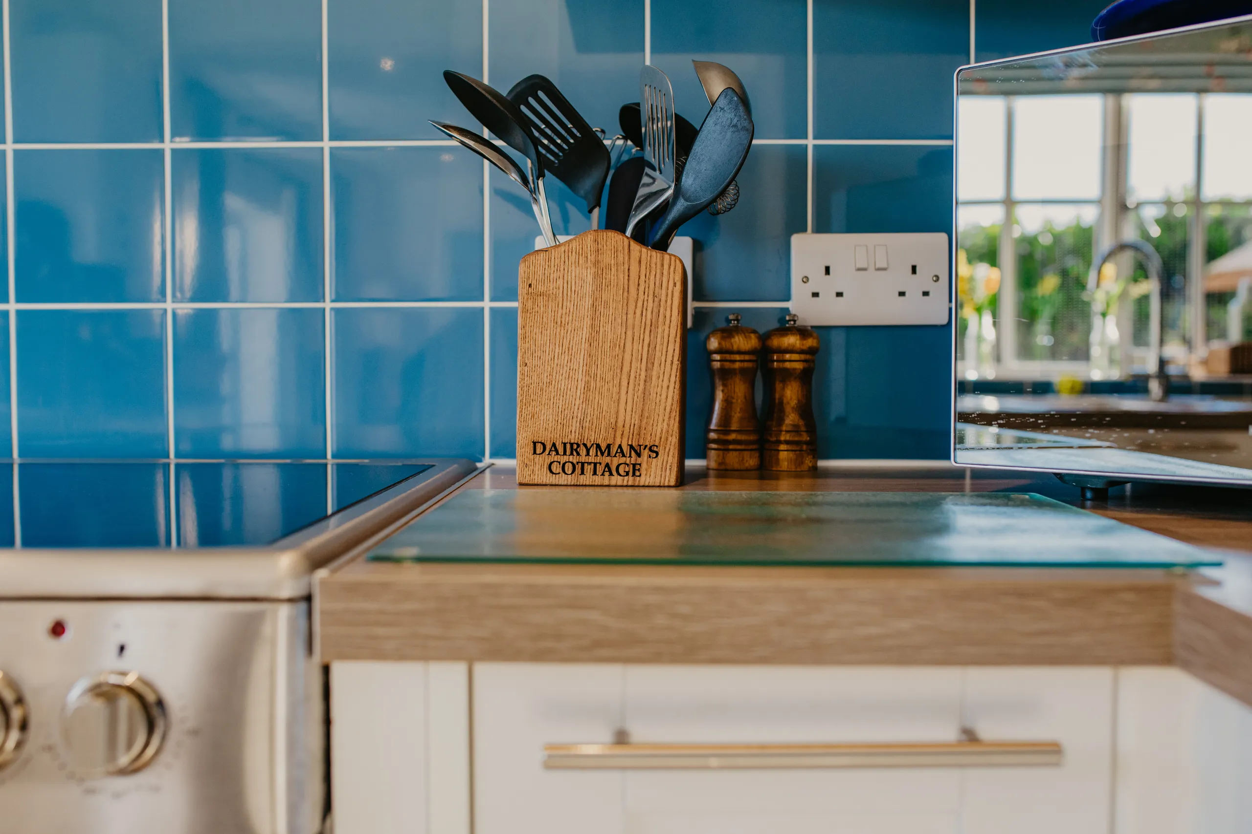 Wooden utensil holder labelled 