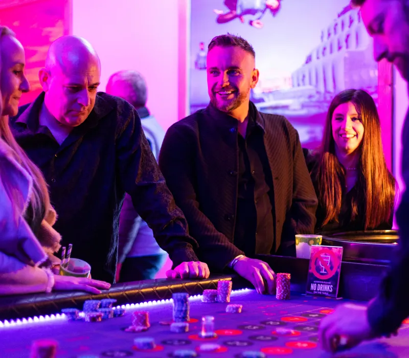 Guests enjoying a casino table at a Christmas party at Tap N Ale, Tapnell Farm