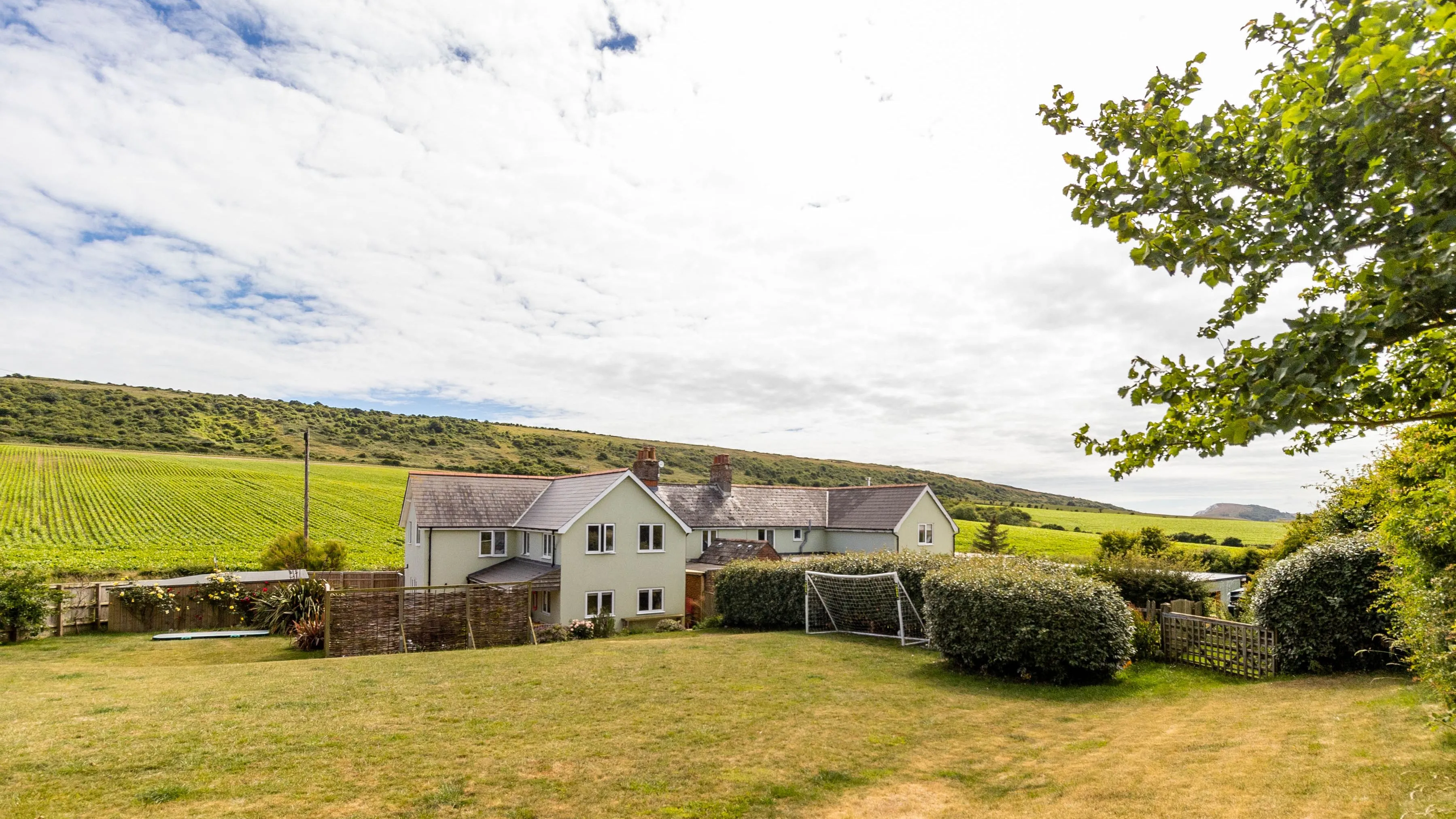 Poachers Lodge exterior with large garden and countryside views