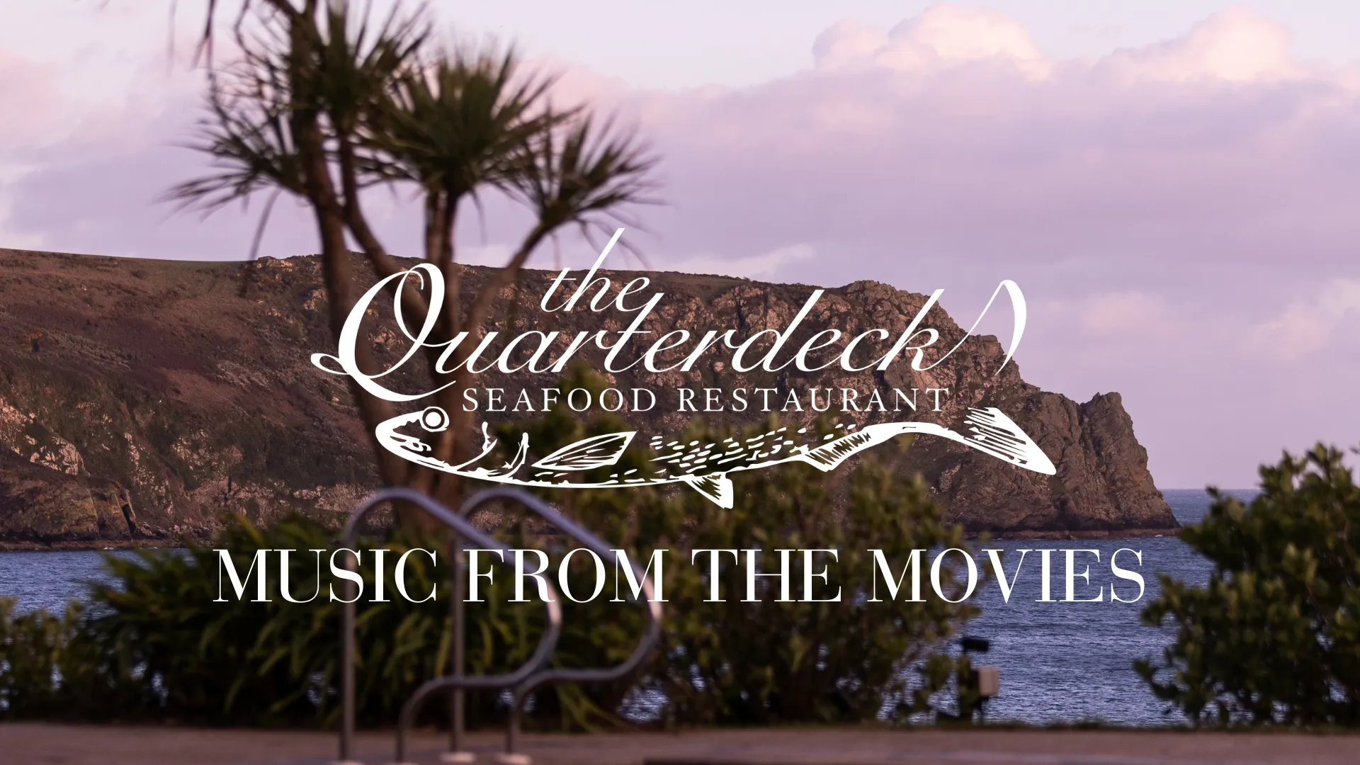 Promotional graphic for The Quarterdeck Seafood Restaurant featuring a coastal cliff and palm tree at dusk.