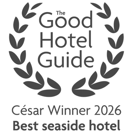 Laurel wreath award badge reading 'The Good Hotel Guide, César Winner 2026, Best seaside hotel'.