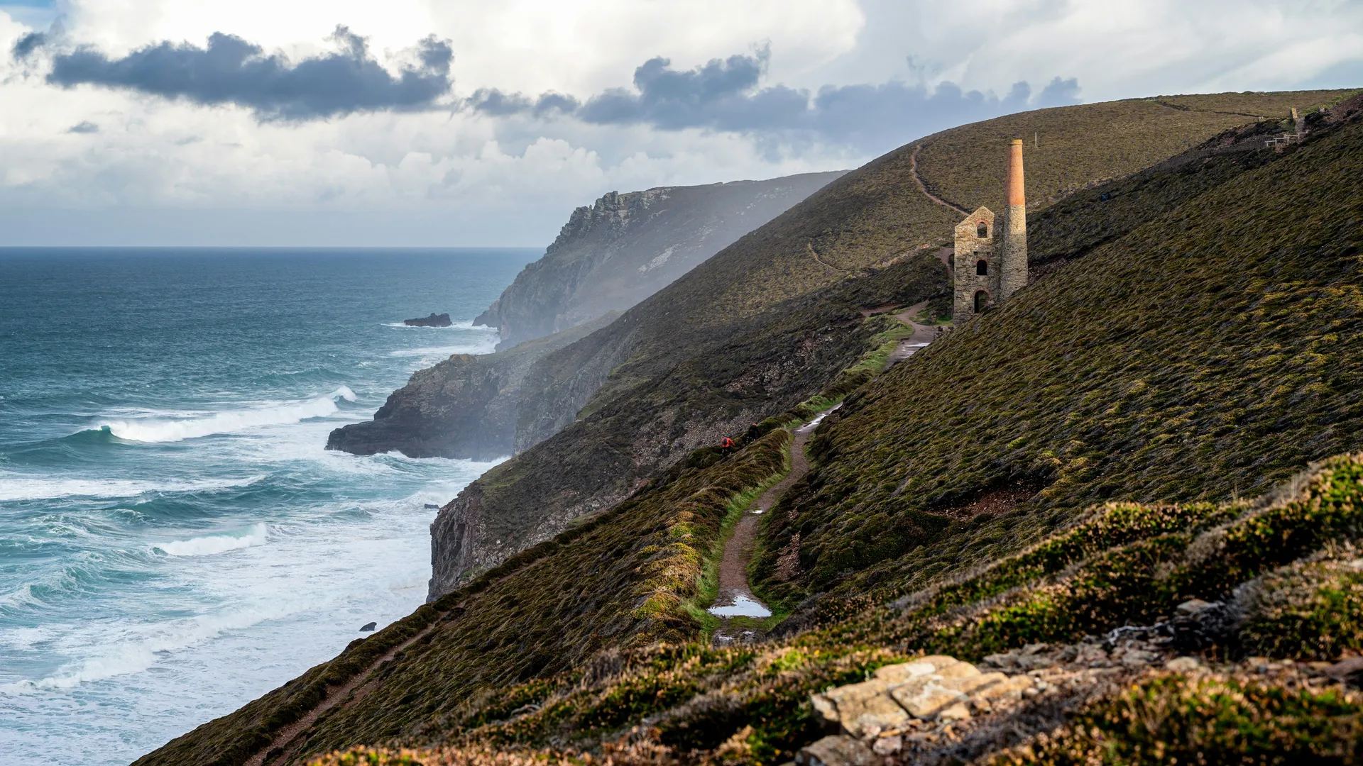 Wheal Coates Staint Agnes Rugged coastal cliffs with a winding path leading to an old engine house above the sea under dramatic clouds