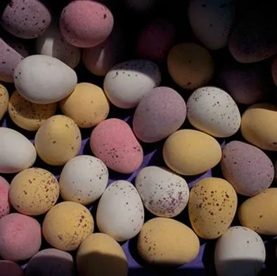 Colorful speckled Easter eggs arranged together