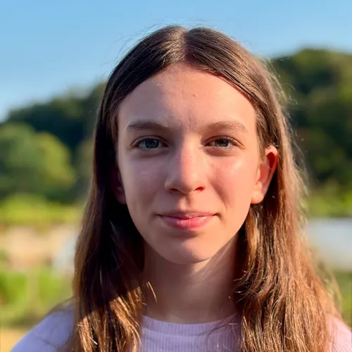 Portrait of dancer Eve Rose Miller outdoors in soft evening light